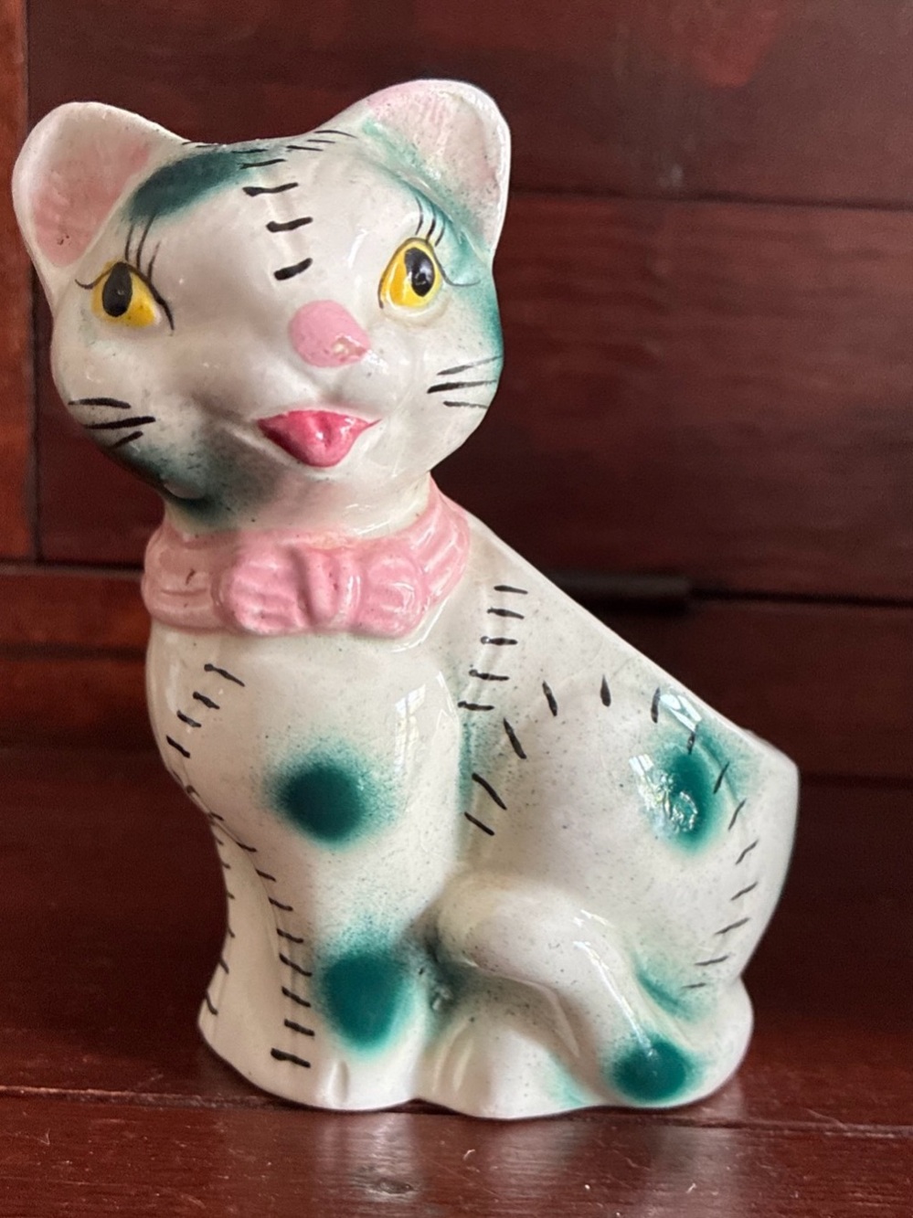 This is a vintage ceramic cat figurine planter. Made in Japan